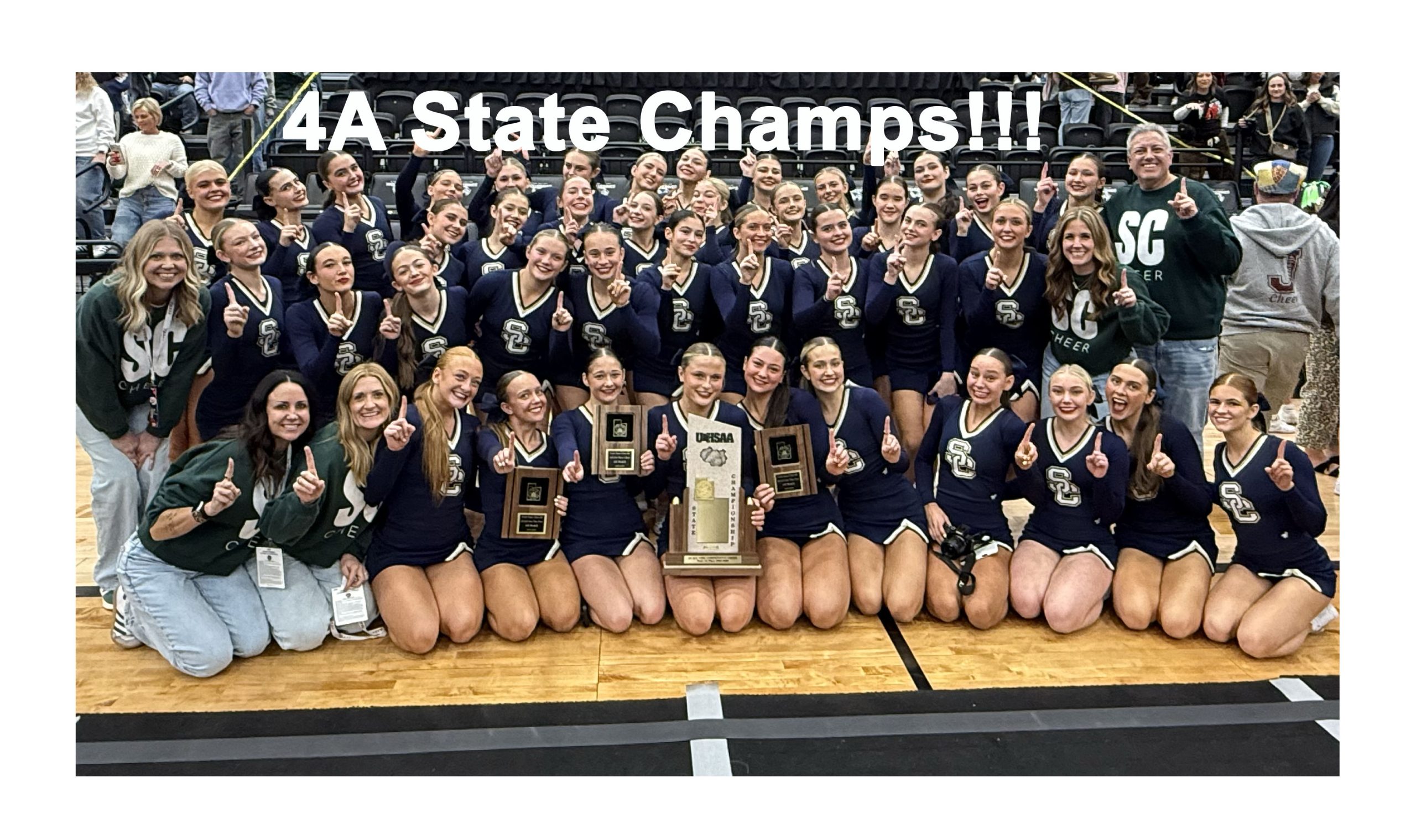 Cheer team with State trophy